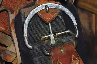 When you saddle your horse, secure your horse's saddle's points of attachment in the proper order to keep the saddle in place.